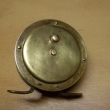 ROUSEK  mosazn� ,   pr. 62 mm, s �ehta�kou, vyv�en� kli�ka ,signovan� Fishing sport �.S.R
